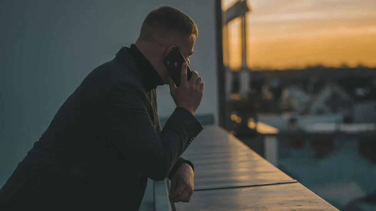 phone call next to railing