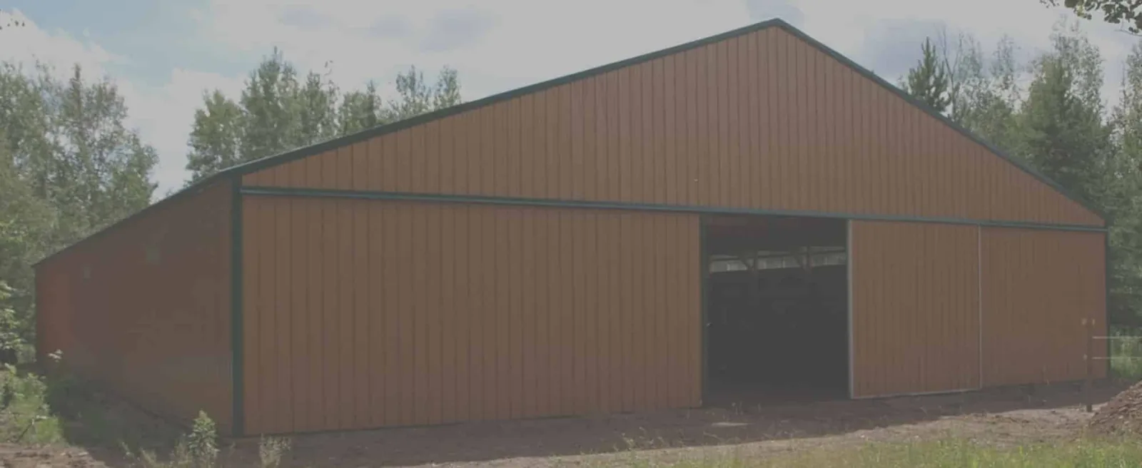 Sherman agricultural pole building with overhead door