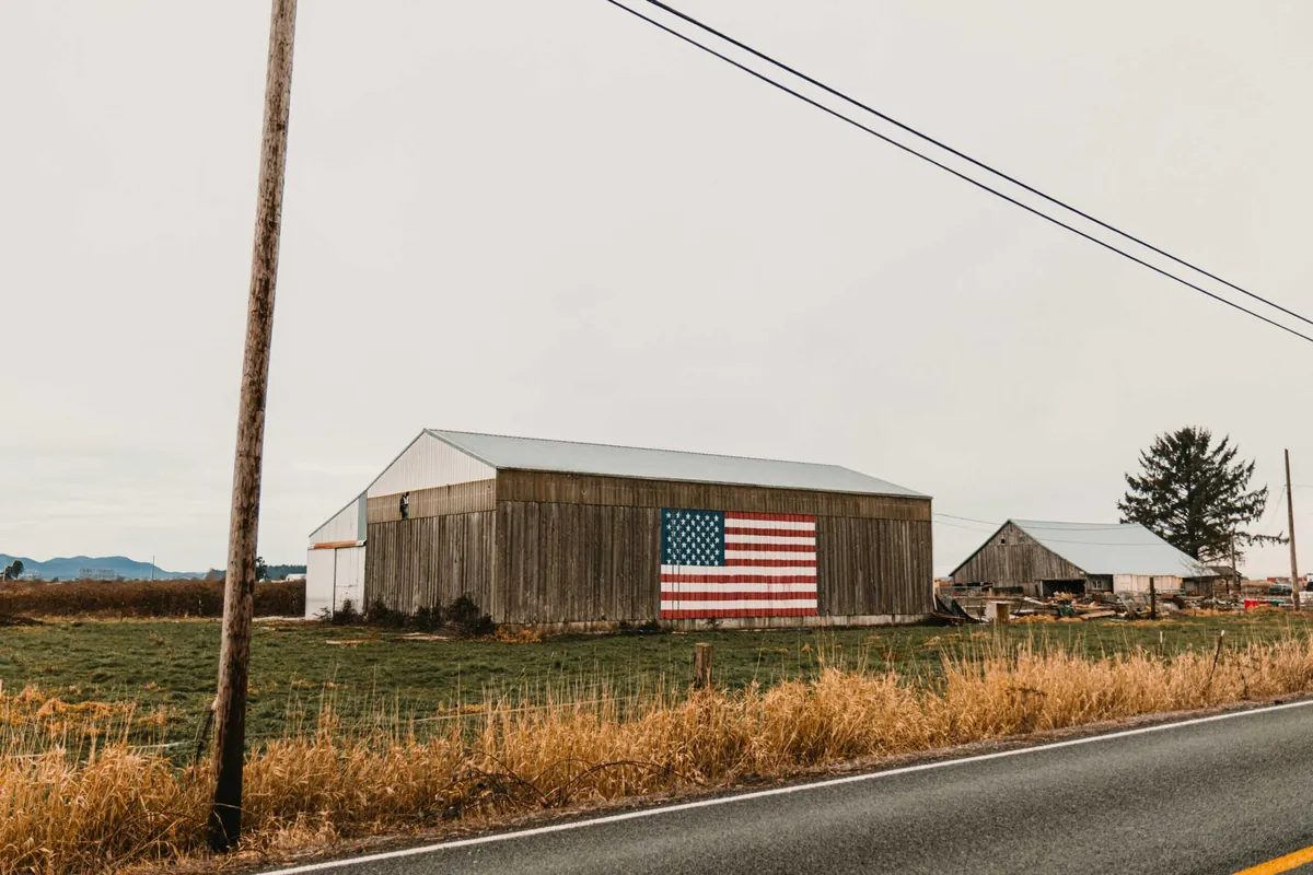 pole barn with American Flag on it